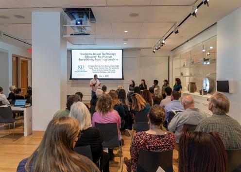 Guests at the panel event for the How the Light Gets In exhibit